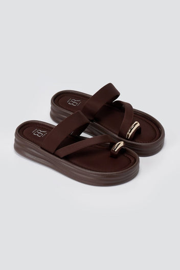 Pair of brown flatform toe ring sandals angled to show the chunky sole, padded straps and metal ring at the toe